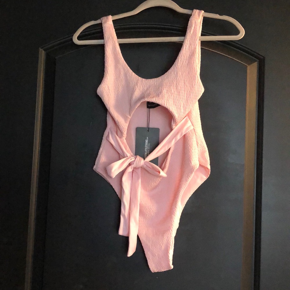 Brand new pink cut out one piece swimsuit